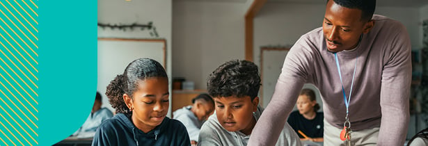 Teacher looking over students in classroom