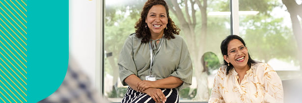 Two teachers laughing