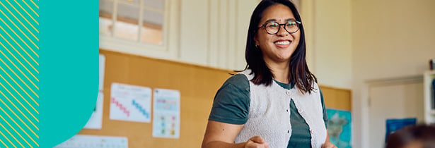 Teacher laughing in classroom