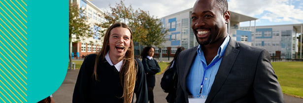 Teacher and student outside school grounds