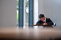 Student sat at a desk