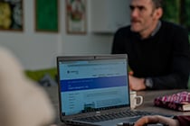 Teacher working on a laptop