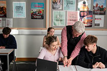 Teacher and students in lesson