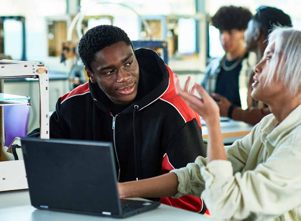 Student and Teacher at laptop