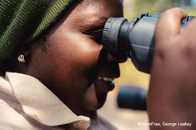 Lady looking through binoculars