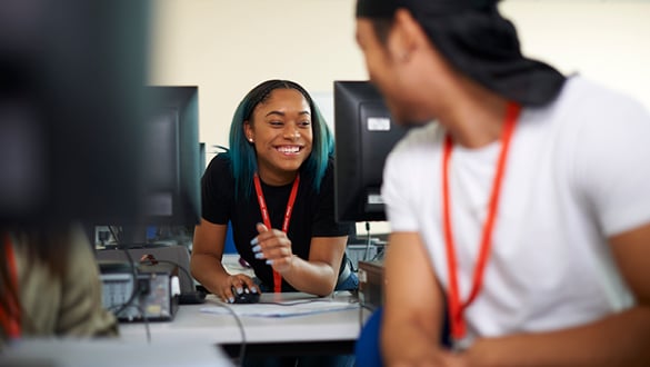 two sixth form students in a classroom