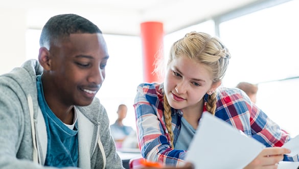 Two sixth form students in a classroom