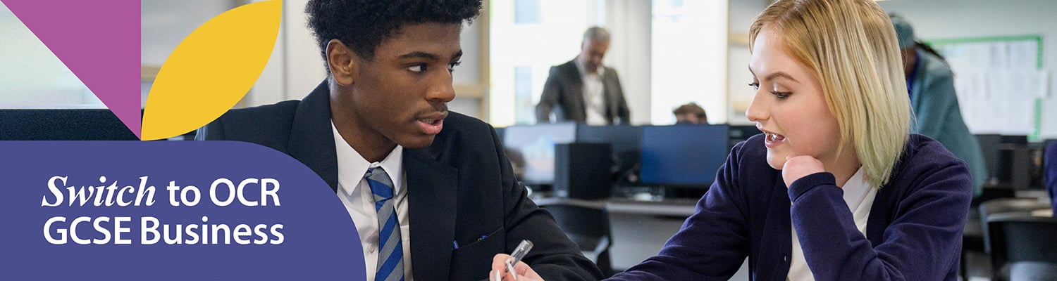 Male and female student discussion their work