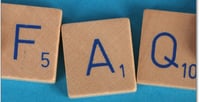 Scrabble tiles that spell out FAQ