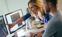teachers looking at a computer screen