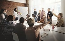 People in a room talking