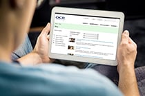 OCR blog on a tablet being held by a male