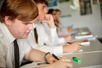 A Level 2 x male students at their desks