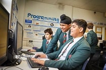 Computing students on computers in the classroom