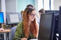 Female student sitting at computer