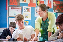 Teacher and student in a classroom