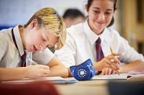 OswestrySchool Female and Male maths student at their desk