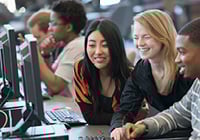 teacher working with students