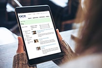 Person reading OCR blog webpage