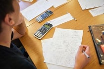 Maths students work on their desk