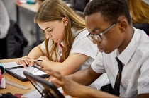 2 students working in a classroom