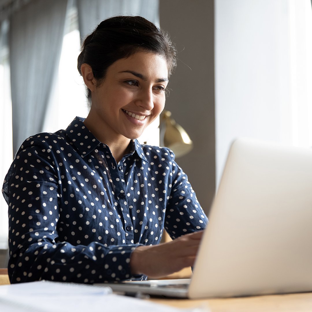 A teacher working on a laptop A teacher working on a laptop