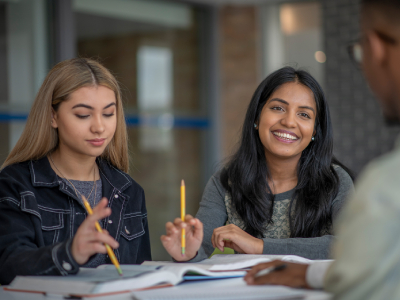 2 female business a level students studying